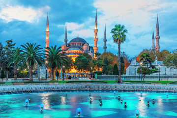The Sultan Ahmet Mosque and the fountain in the blue shadows of sunrise, Istanbul