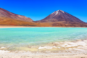 The majestic Laguna Verde or Green Lagoon in the altiplano of Bolivia with the Licancabur volcano in the background near the Salar de Uyuni (Uyuni salt flat), Bolivia.