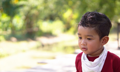 1.8 years old Happy Little Asian baby boy child wearing a red t-shirt showing front teeth with big smile Healthy happy funny smiling face young adorable lovely kid.