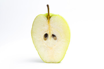 Green pear in a cut on a white background. close up