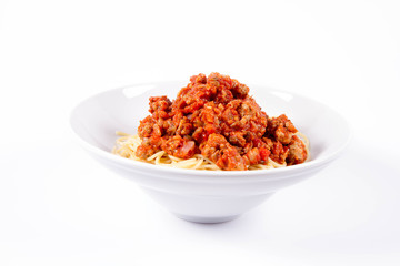 Spaghetti bolognese on a plate on a white background	