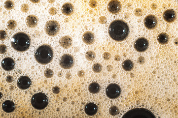 Air bubble foam formed on freshly flavored black coffee.