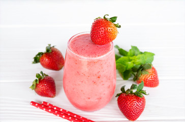 Strawberry yogurt fruit juice smoothie pink colorful fruit juice milkshake blend beverage healthy high protein the taste yummy In glass drink episode morning on white wood background.