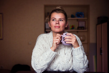 beautiful woman hold cup of tea at home