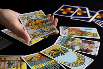 Bangkok,Thailand,november.13.19. Tarot cartomancy. Cards for divination on a black background with...