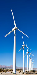 Wind Turbines from a wind farm against a blue sky