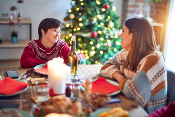 Beautiful family smiling happy and confident. Eating roasted turkey celebrating christmas at home