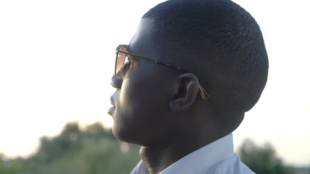Young american afrcan man contemplating sunset.Ideas, hopes,future.