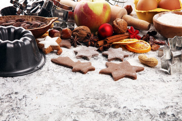 Baking christmas cookies. Typical cinnamon stars bakery with spices. xmas decoration on table