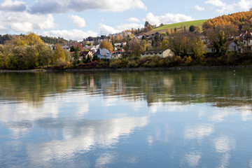 Fototapeta na wymiar Water reflection of clouds on danube by passau, Germany