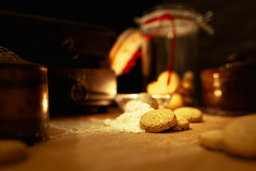 Christmas cookies with festive decoration on a rustic wooden table with colorful bokeh and copy space