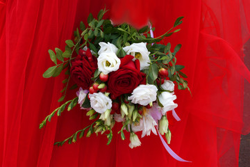 wedding bouquet on a background of red organza