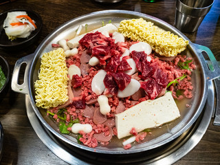 cooking soup from ramen noodles with beef, sausage