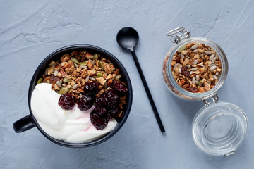 Breakfast with granola and yogurt, flat lay
