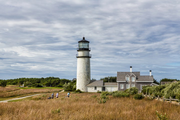 Fototapeta na wymiar Highland Lighthouse, Cape Cod National Seashore, North Truro, Massachusetts with golfers in foreground. 