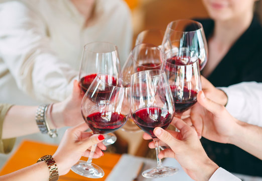 Close-up Of Friends Toasting Wineglasses At Party