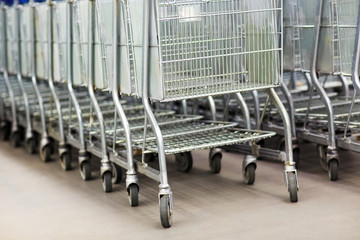 Row of shopping carts at supermarket entrance