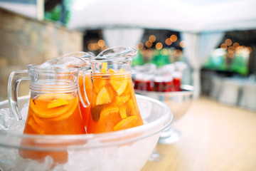 Jugs of lemonade in the ice.