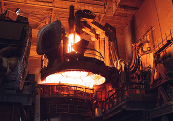 Melting of metal in a steel plant. High temperature in the melting furnace.