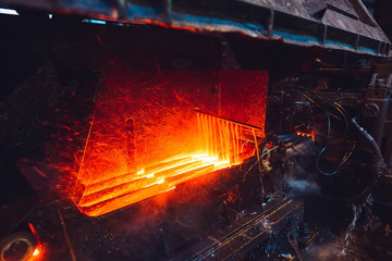 hot steel on conveyor in steel mill