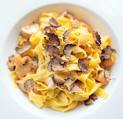 Pasta with truffles, typical autumn dish.Restaurant menu dish.