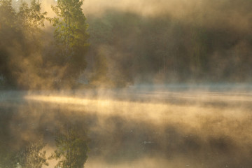 Obraz na płótnie Canvas >Fog on a lake in the oslo region, Norway