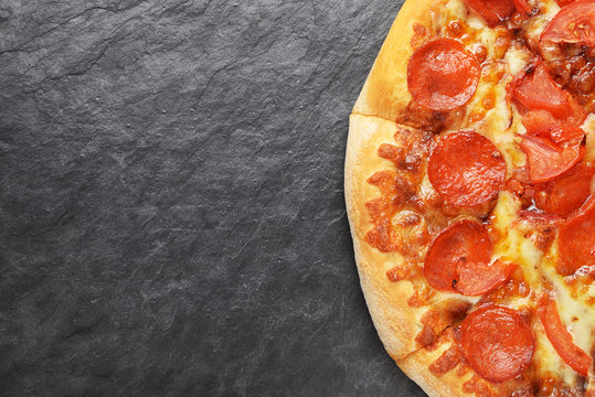 Pepperoni Pizza On Black Slate Background With Ocopy Space