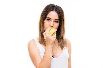 Young woman over isolated white background with an apple