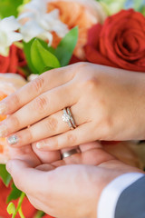 Fototapeta premium Wedding couple hands with rings