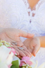 wedding couple holding rings
