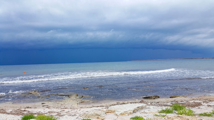 wave on the sea coast and beautiful sandy beach. Beautiful cloudy landscape over the sea.
