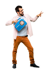 Handsome man with beard holding a radio