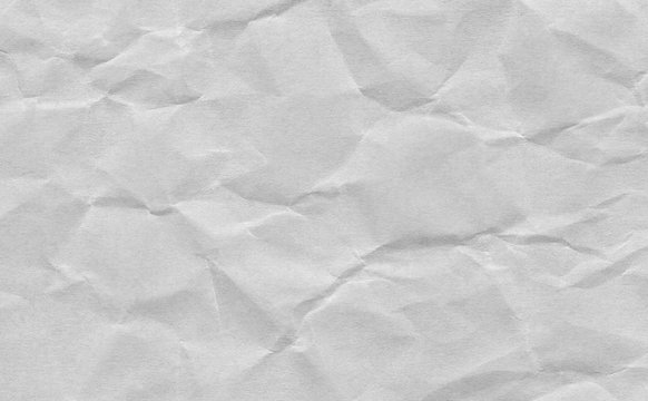 Closeup crumpled grey paper texture background, texture.Gery paper sheet board with space for text ,pattern or abstract background.