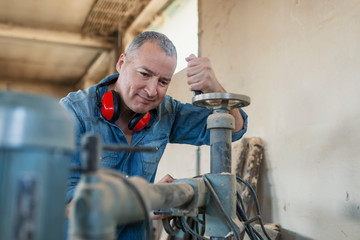 Carpenter using electric saw in carpentry