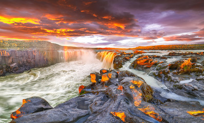 Dramatic sunset view of fantastic waterfall and cascades of Selfoss waterfall. © pilat666