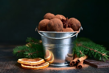 Homemade chocolate truffles with orange and winter spices.