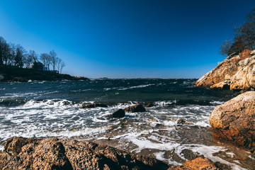 Rough waters crashing waves on rocks