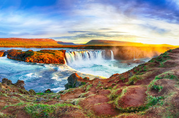 Fantastic sunrise scene of powerful Godafoss waterfall.