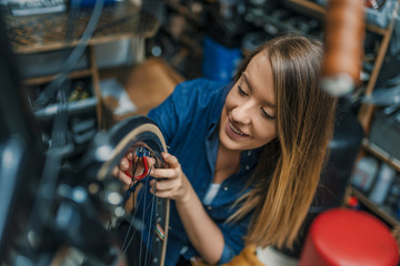 Making some adjustments to her bike