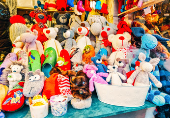Riga, Latvia - December 25, 2015: Handmade animal toys on display for sale at the Christmas market in winter Riga in Latvia.
