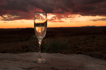 glass of champaign in the African Sunset