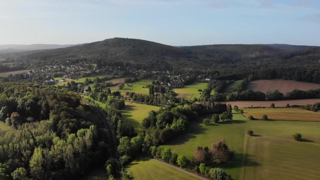 This mountain range is called Teutoburg Forest. The place is located south of the Westphalian town of Horn. This aerial photograph shows a railroad track below.