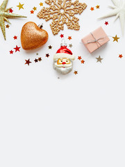 Christmas and New Year background with sparkling fir tree, Santa Claus, heart, snowflakes and star confetti. Holiday decorations on white background.