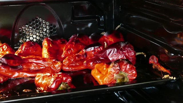 red pepper in the oven to barbecue, red peppers are baking,