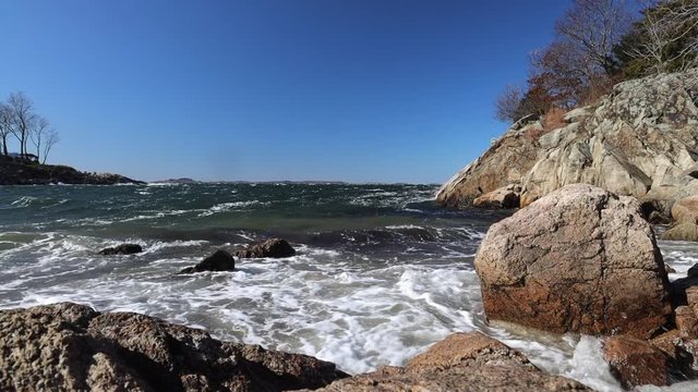 choppy waves in atlantic ocean crashing onto beach in gloucester massachusetts in New England in Winter