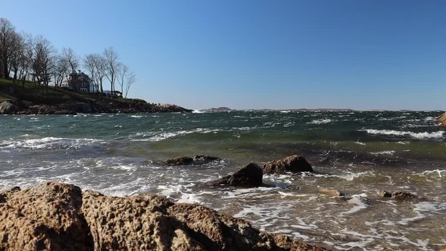 choppy waves in atlantic ocean crashing onto beach in gloucester massachusetts in New England in Winter