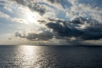 Naklejka na ściany i meble sunset on the sea with beautiful cloud patterns