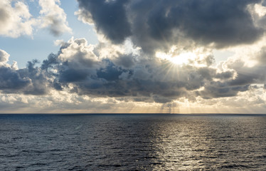 Naklejka na ściany i meble sunset on the sea with beautiful cloud patterns