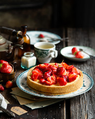 Homemade delicious strawberry tart or pie with sweet glazed berries on top