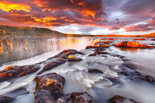 Dramatic sunset view of fantastic waterfall and cascades of Selfoss waterfall.